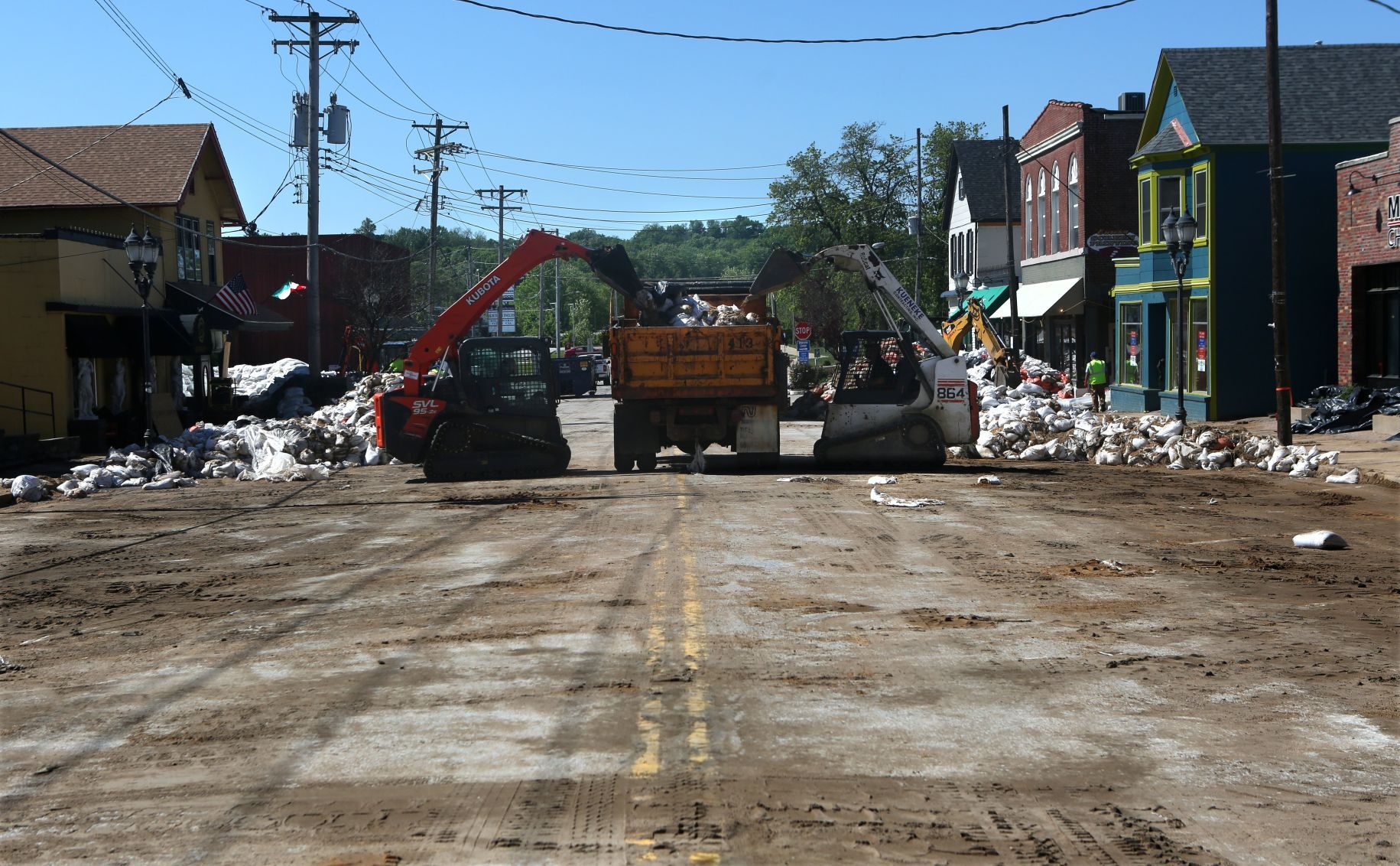 Sandbag levee wall coming down